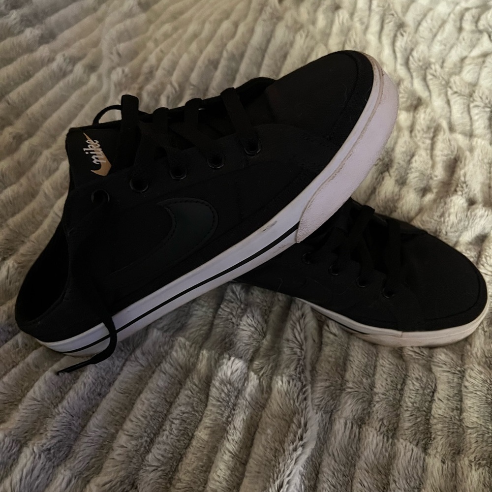 Black Nike slip on sneakers. Women’s size 7.